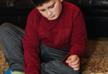 A boy playing Pokémon cards