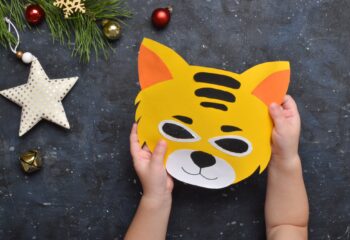 Detailed step-by-step instructions for making tiger masks from paper for children.
