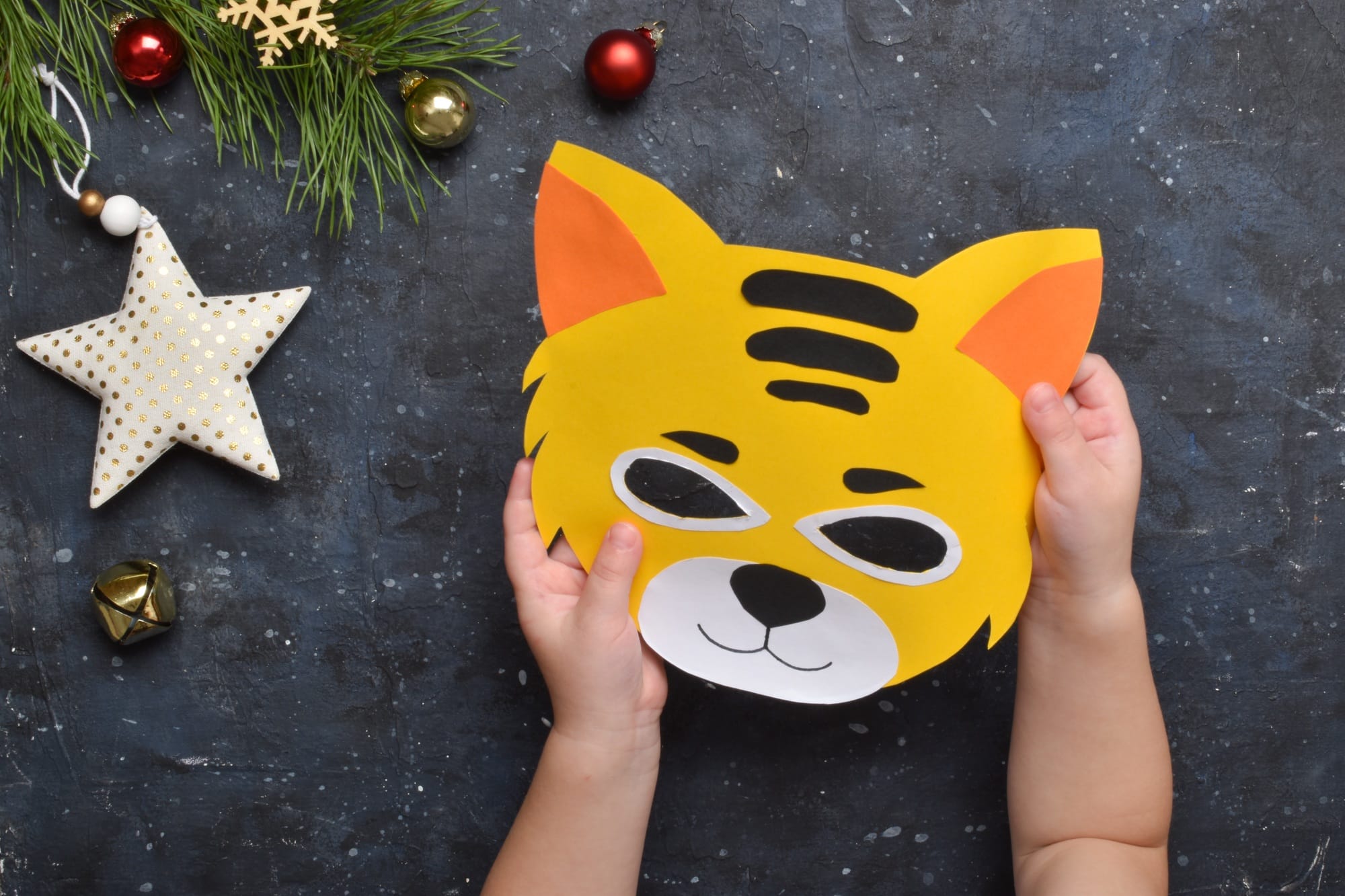 Detailed step-by-step instructions for making tiger masks from paper for children.