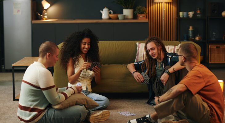 Friends Playing Card Game in Cozy Living Room