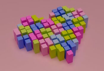 Geometric heart divided in pixel blocks over pink background