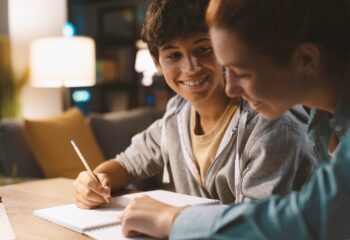 Students doing homework together at home