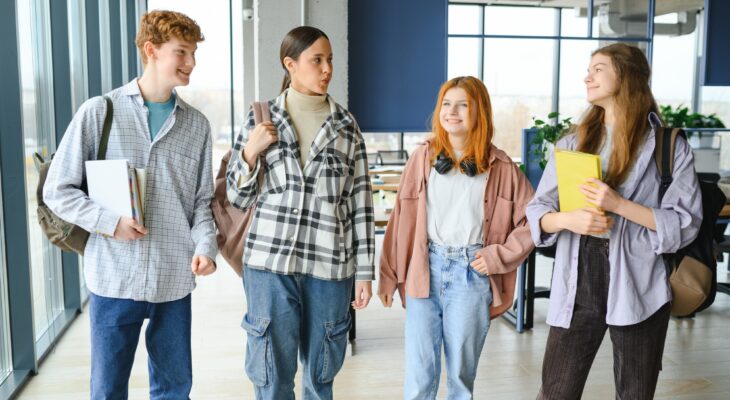 Happy high school students in the classroom